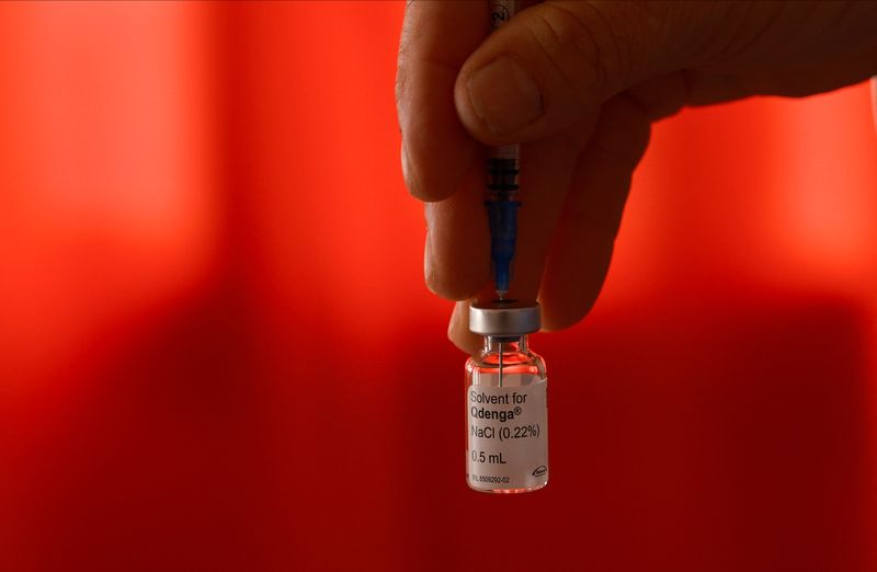 A health worker holds a vial of dengue vaccine Qdenga, in Joquin V. Gonzalez, Salta, Argentina March 16, 2024.