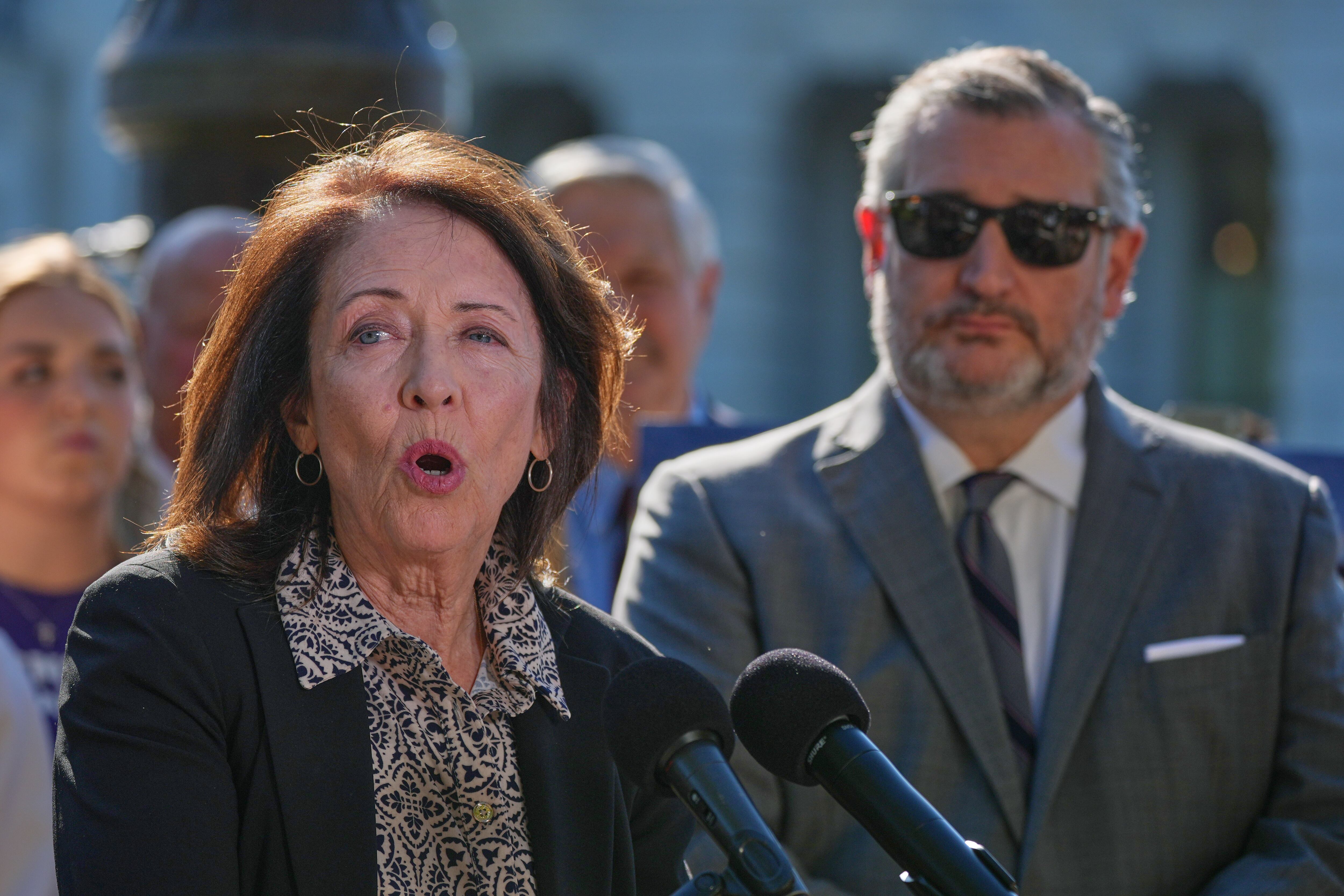 Sen. Maria Cantwell, D-Wash., speaks as Sen. Ted Cruz, R-Texas, listens during a news conference on Capitol Hill, Monday, in Washington. Cantwell, the Democratic sponsor of the Protect College Sports Act, called the act the "last best chance to save college sports."
