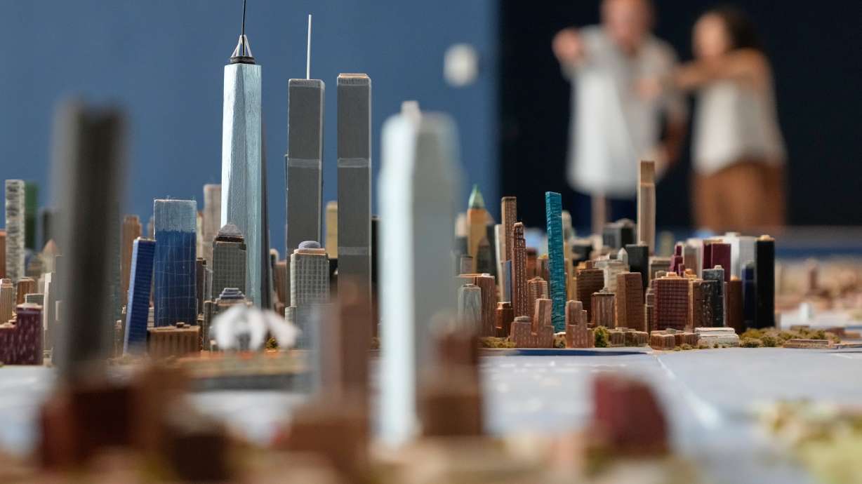 Lower Manhattan, featuring both the One World Trade and the Twin Towers, is seen on a large model of New York City, made by Joe Macken, at the Museum of the City of New York in New York, on Monday.