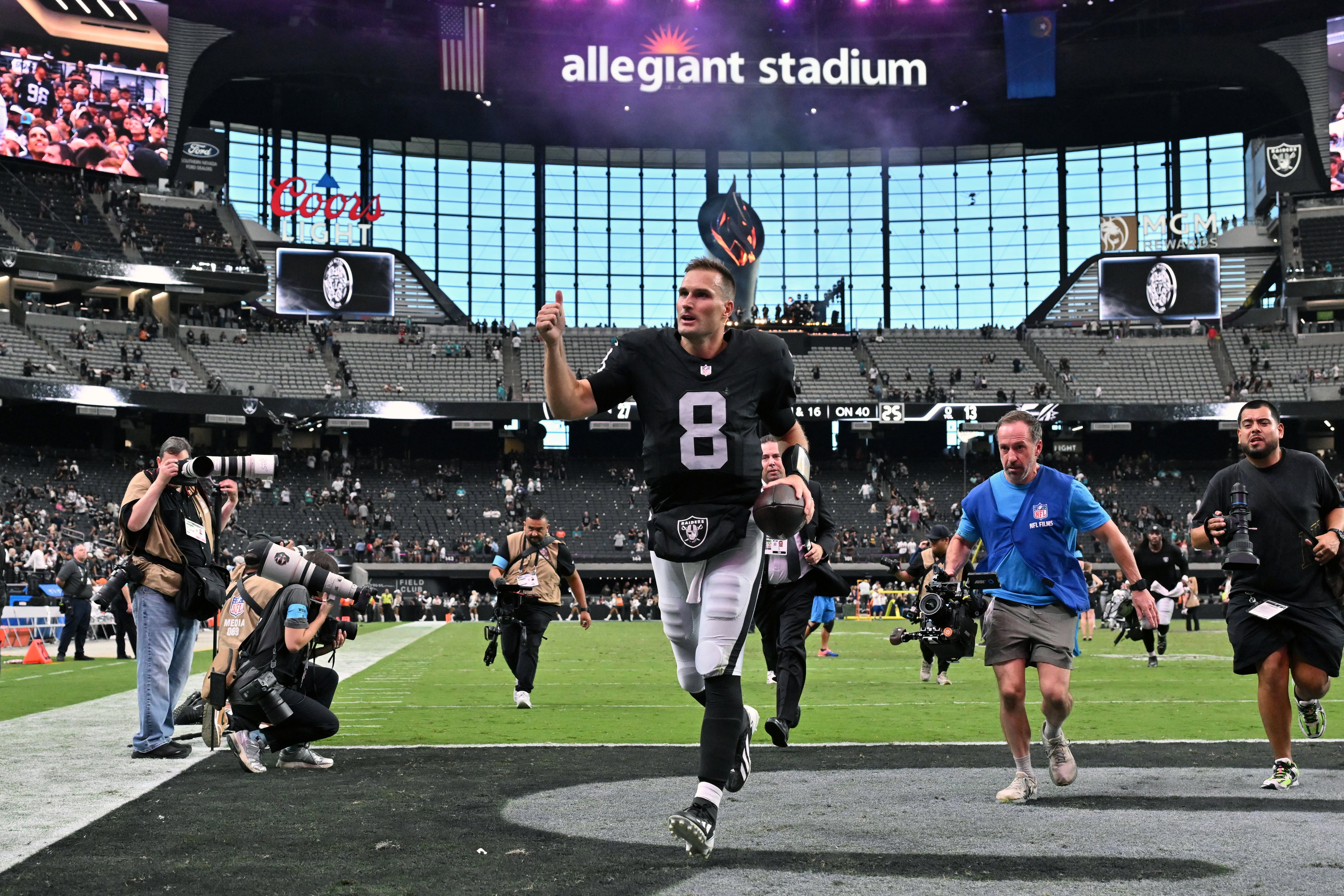 Las Vegas Raiders quarterback Kirk Cousins runs off the field after facing the Miami Dolphins, Sunday, in Las Vegas. Gov. Spencer Cox is seeking to deepen the Raiders' ties to Utah.