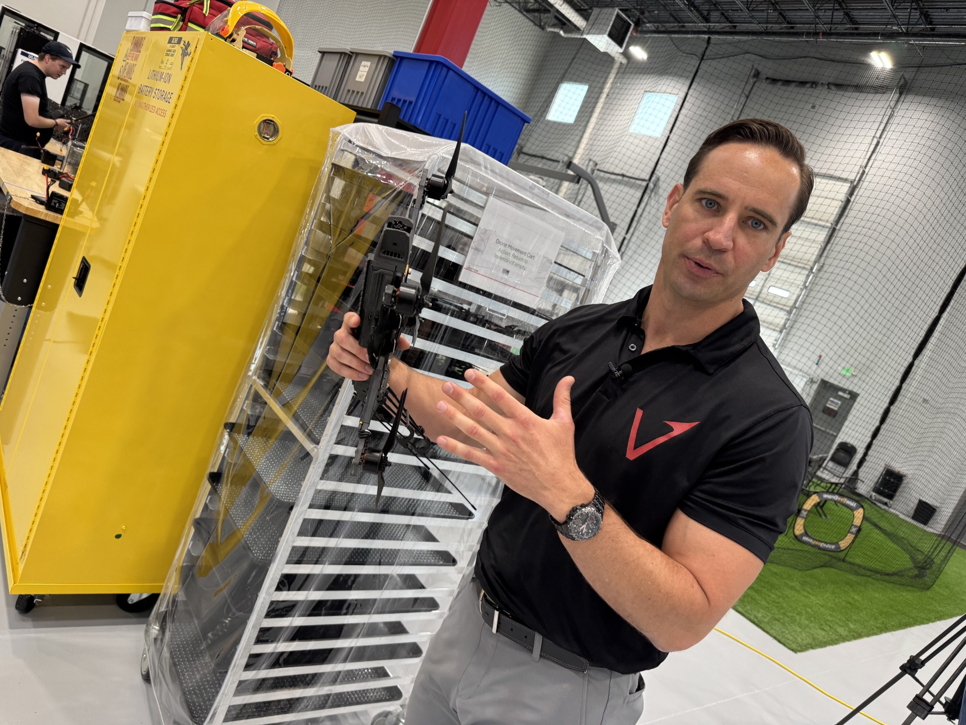 Vector co-founder and CEO Andy Yakulis shows off a drone inside his company's Bluffdale production facility.