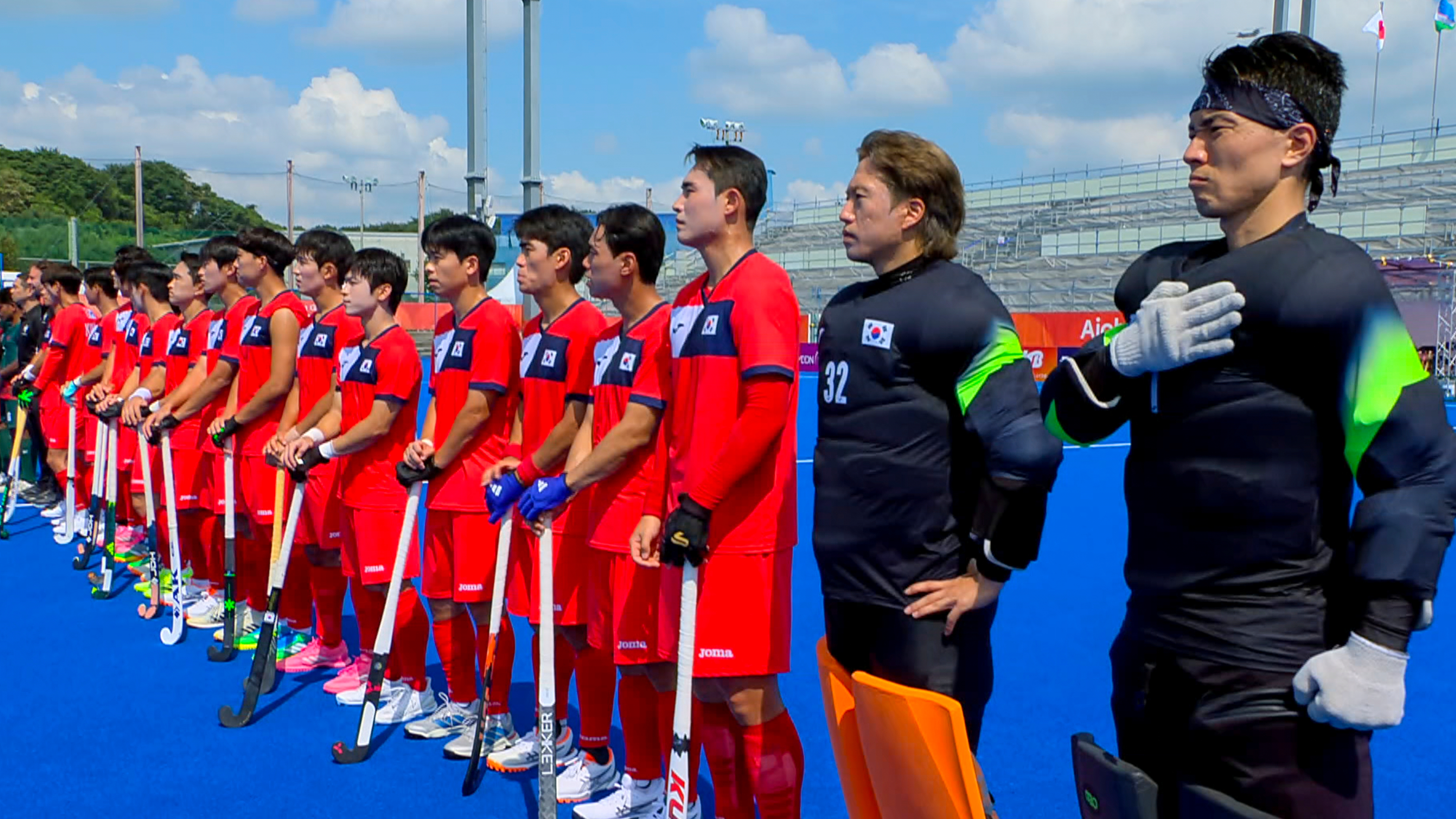 In this image made from video, South Korean men's field hockey players react as the North Korean national anthem is played ahead of their game against Bangladesh at the Asian Games in Kakamigahara city, Gifu prefecture, Japan, Friday, Sept. 18, 2026. 