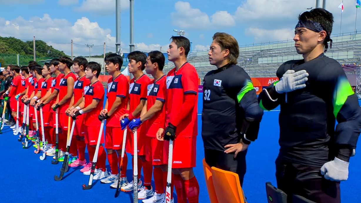 In this image made from video, South Korean men's field hockey players react as the North Korean national anthem is played ahead of their game against Bangladesh at the Asian Games in Kakamigahara city, Gifu prefecture, Japan, Friday, Sept. 18, 2026.