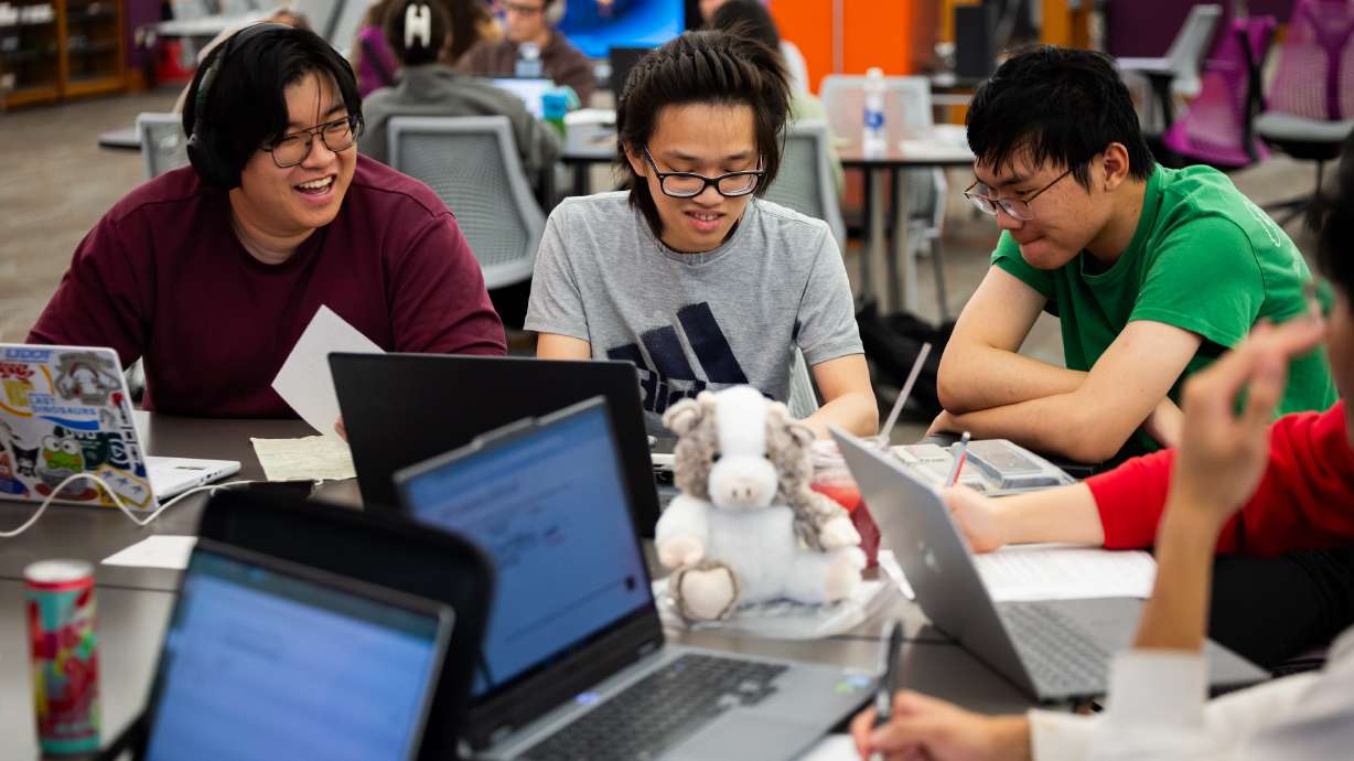 University of Utah students Tyler Le, 20, Brannon Lai, 18, and Jeffrey Zou, 19, from left, work at the J. Willard Marriott Library in Salt Lake City on April 1. A report from the Kem C. Gardner Policy Institute outlined ways higher education institutions can navigate demographic changes to strengthen higher education across the state.