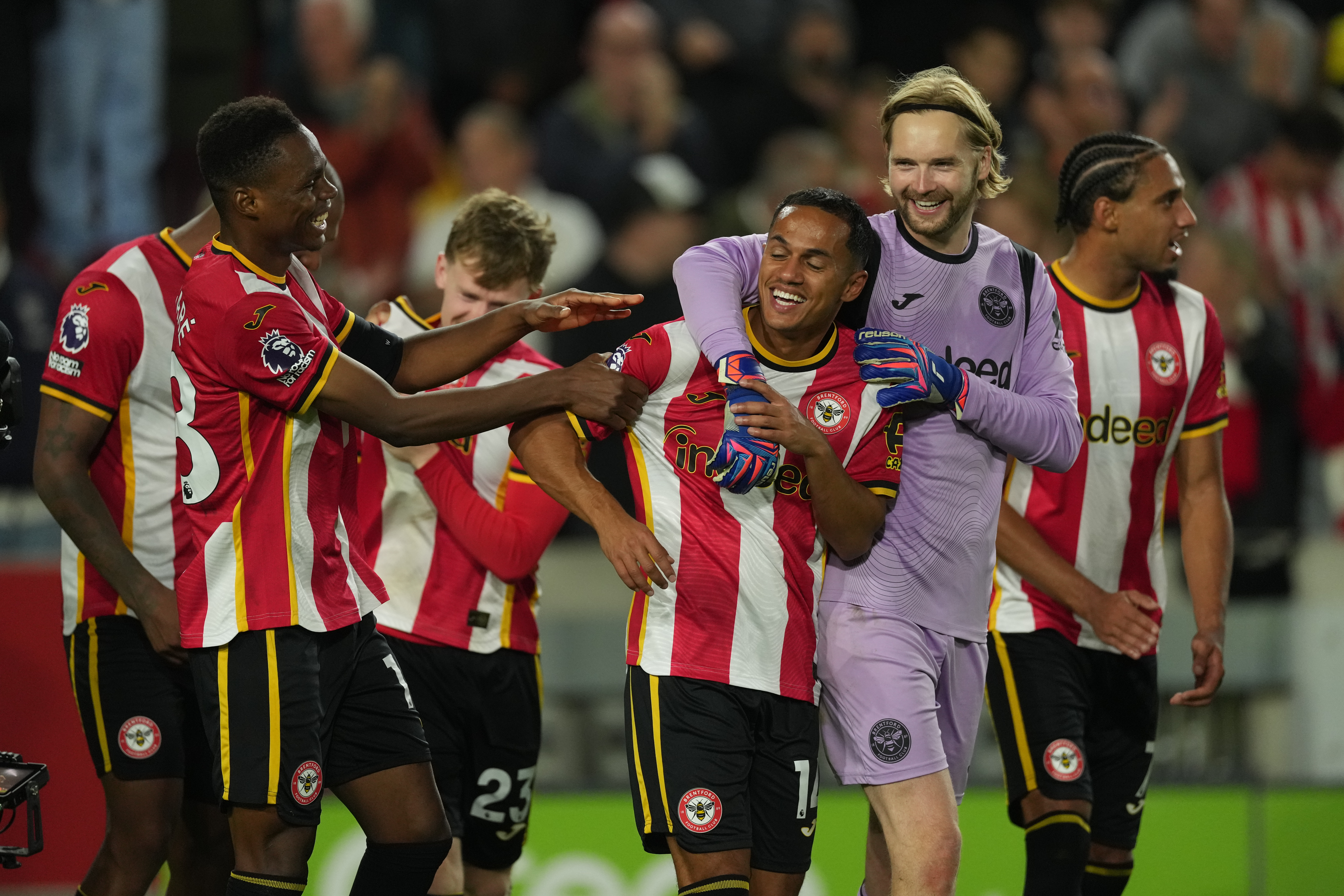 Brentford players celebrate after the Premier League soccer match between Brentford and Chelsea in London, England, Friday, Sept. 18, 2026. 