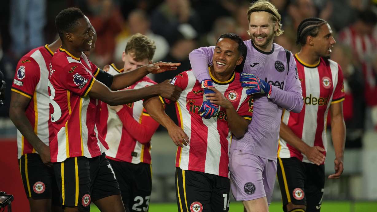 Brentford players celebrate after the Premier League soccer match between Brentford and Chelsea in London, England, Friday, Sept. 18, 2026.