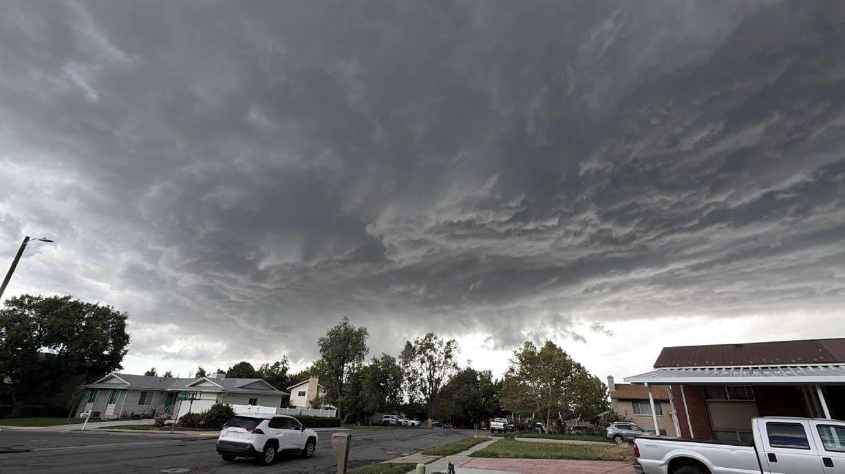 A storm passing through Kaysville on Friday, shortly before a funnel cloud formed. A Davis County neighborhood that was pounded by hail Friday is now being pounded by roofing and repair companies that want to fix the damage.