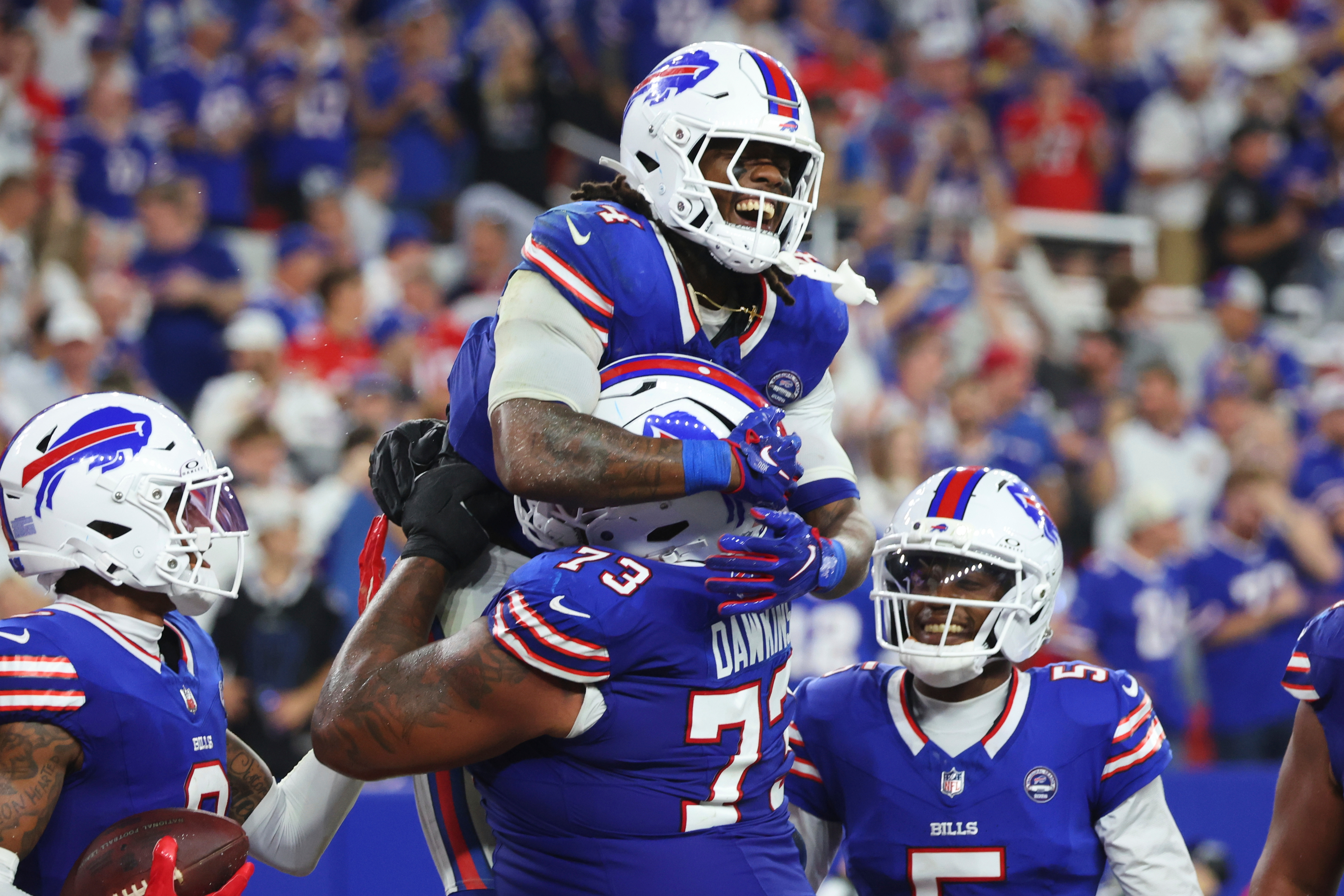 Buffalo Bills running back James Cook (4) celebrates his rushing touchdown against the Detroit Lions during the second half of an NFL football game in Orchard Park, N.Y., Thursday, Sept. 17, 2026. 