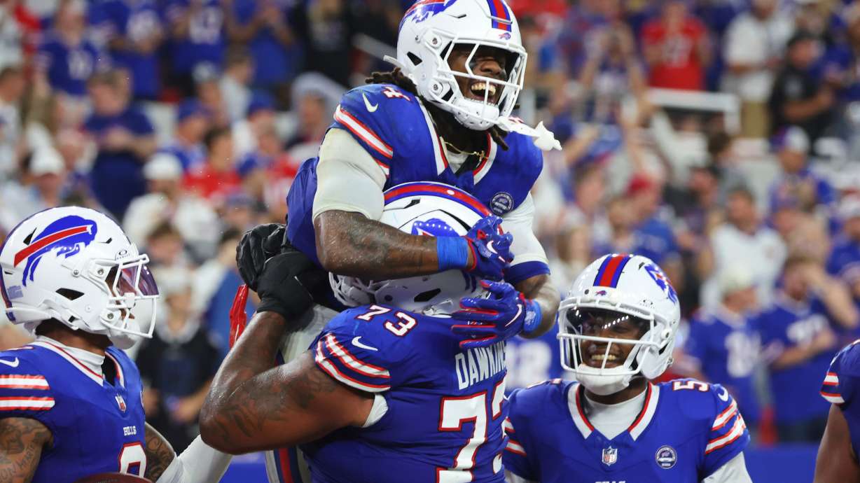 Buffalo Bills running back James Cook (4) celebrates his rushing touchdown against the Detroit Lions during the second half of an NFL football game in Orchard Park, N.Y., Thursday, Sept. 17, 2026.