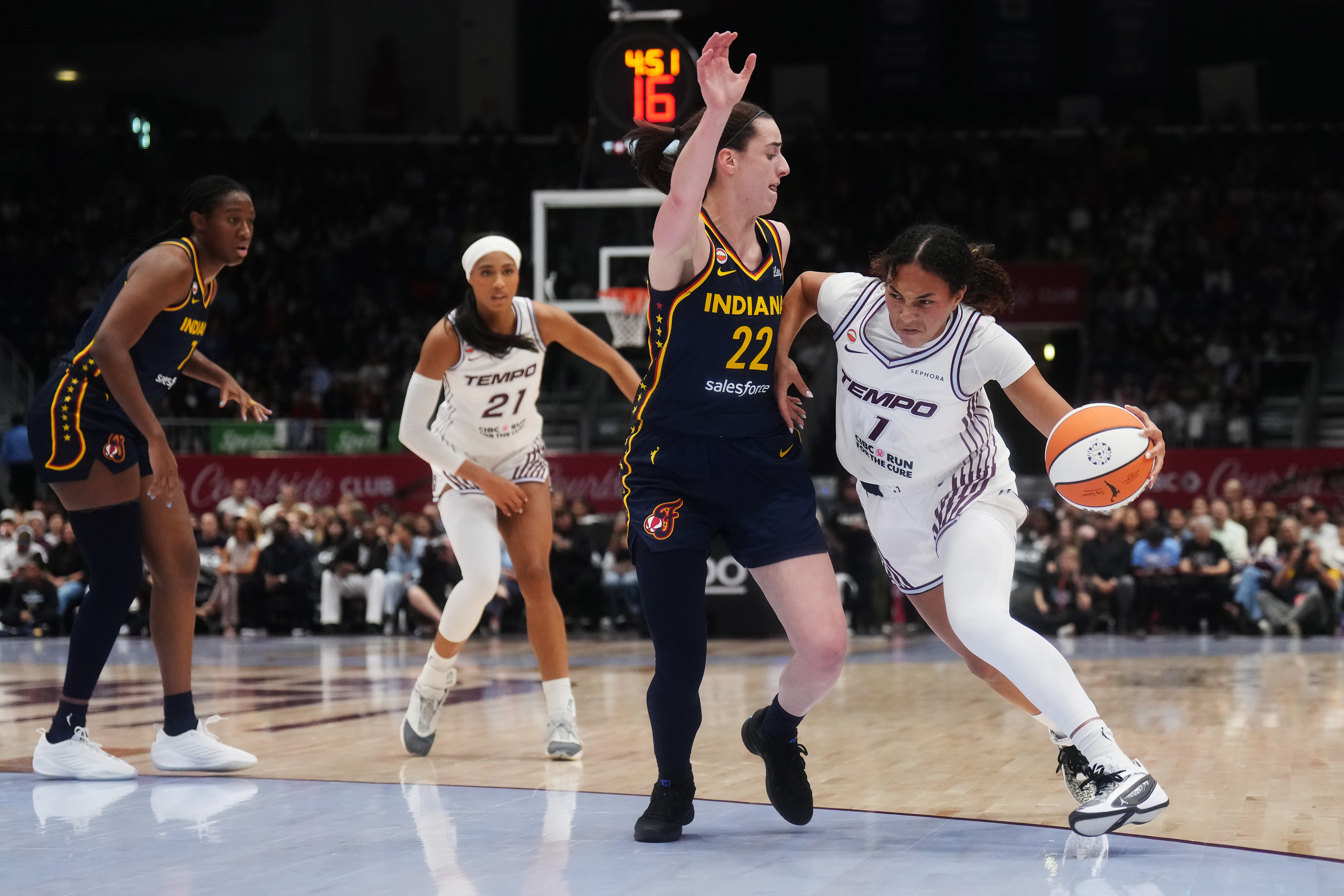 Toronto Tempo's Teonni Key, right, drives as Indiana Fever's Caitlin Clark (22) defends during the first half of a WNBA basketball game in Toronto, Friday, Sept. 18, 2026. 