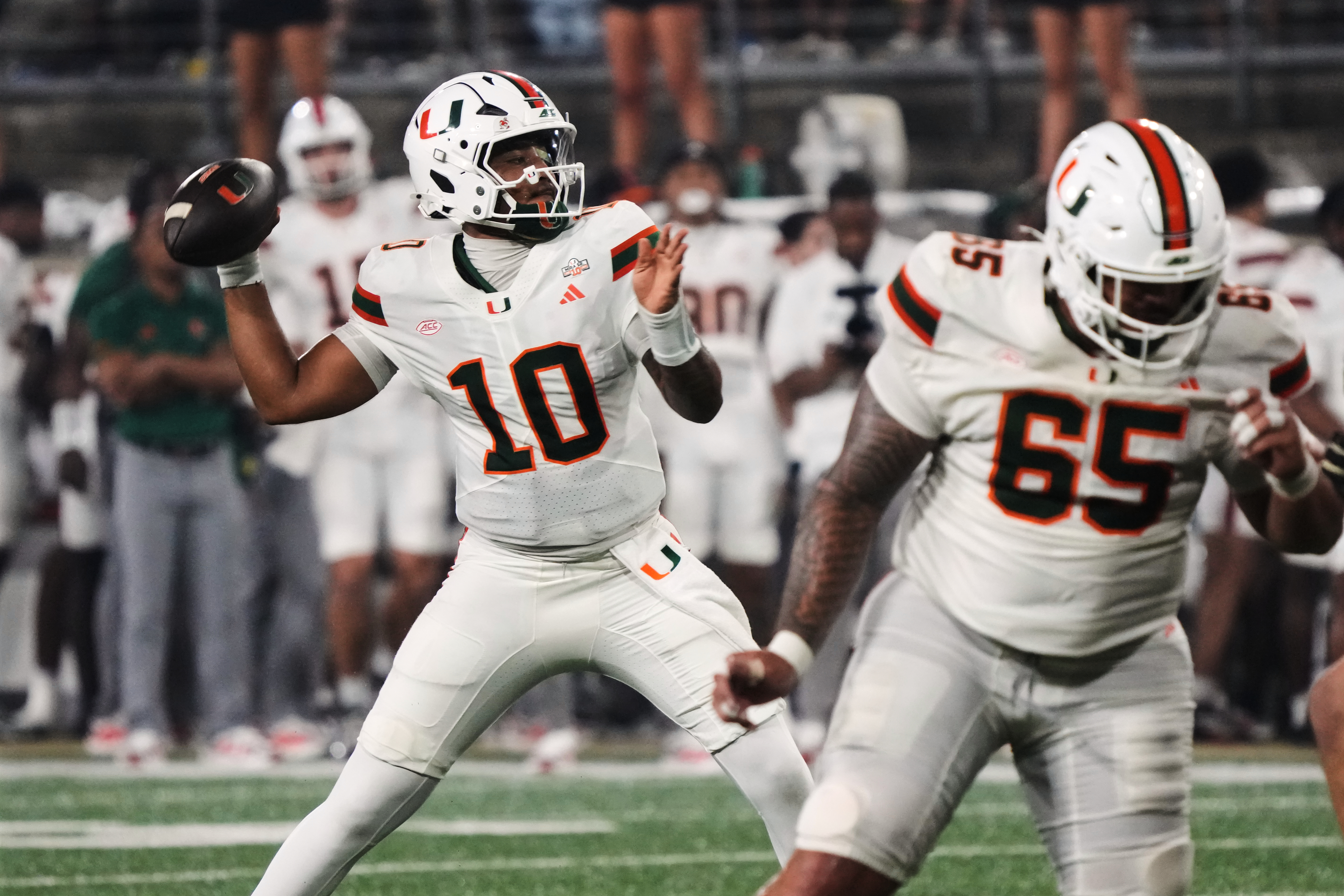 Mensah sets ACC consecutive-completions marks, defense rises in 4th as No. 5 Miami tops Wake Forest