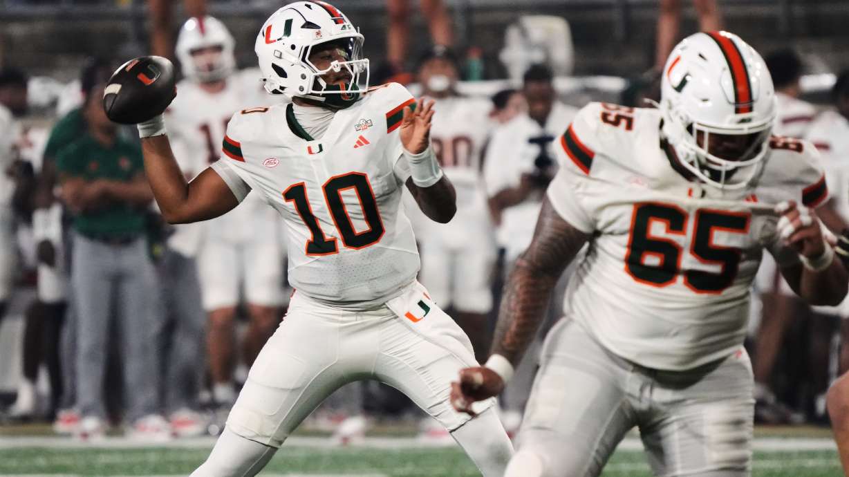 Miami quarterback Darian Mensah (10) looks to pass the ball against Wake Forest during the first half of an NCAA college football game in Winston-Salem, N.C., Friday, Sept. 18, 2026.