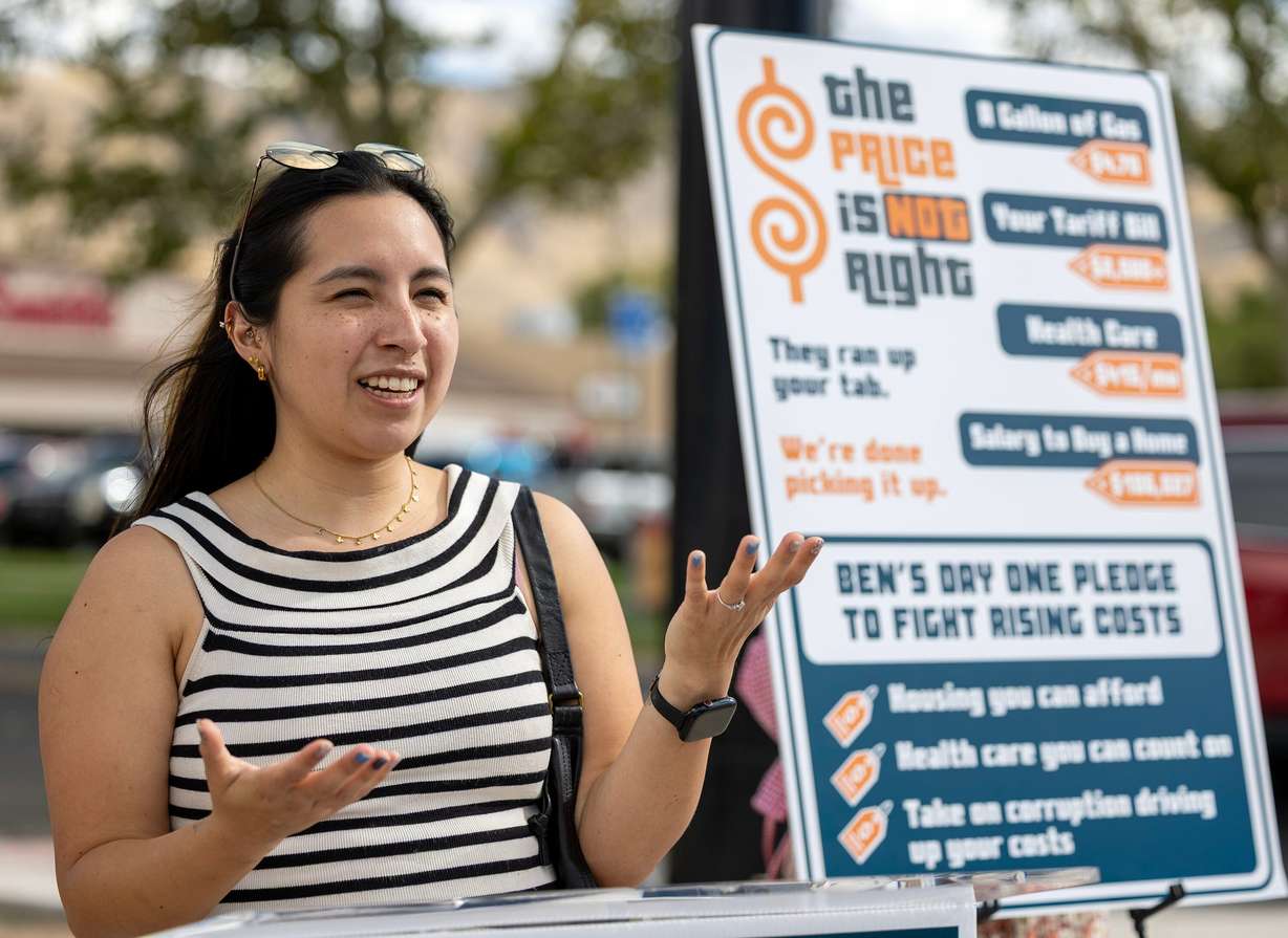 Yunuen Vargas speaks during a press conference where Ben McAdams announced his priorities to bring down costs for Utahns, including at the gas pump, at the checkout line, in their housing costs and in their medical bills, at Neil’s Pro Services in Salt Lake City on Thursday. McAdams also promised to undo the tax cuts from the "big beautiful bill."