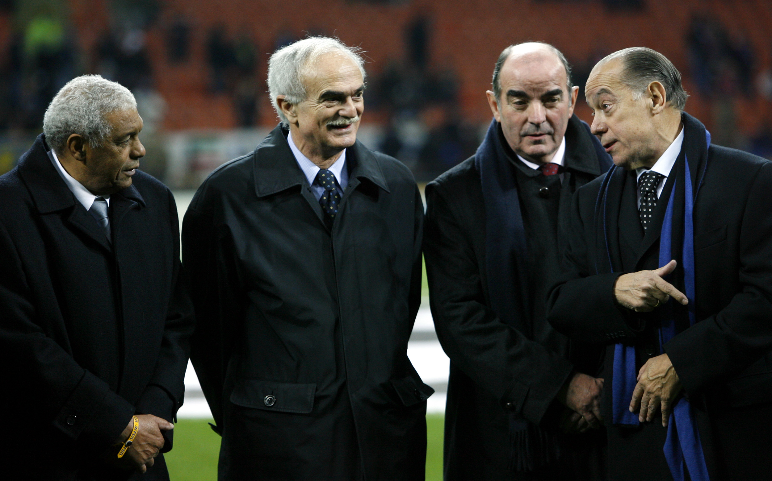 FILE - Inter Milan's former players Sandro Mazzola, second left, with Jair of Brazil, left, Mario Corso and Luis Suarez, right, prior to the start of the Champions League first knockout round, second leg soccer match between Inter and Ajax at the San Siro stadium in Milan, Italy, March 14, 2006. 