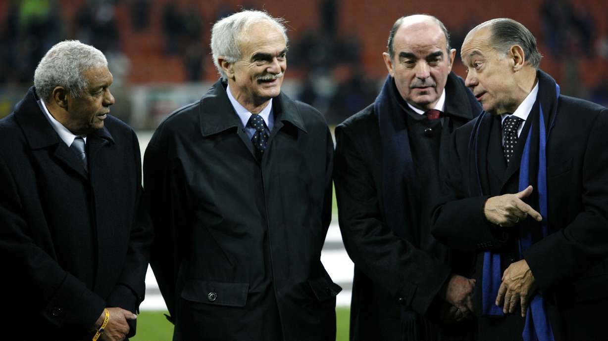 FILE - Inter Milan's former players Sandro Mazzola, second left, with Jair of Brazil, left, Mario Corso and Luis Suarez, right, prior to the start of the Champions League first knockout round, second leg soccer match between Inter and Ajax at the San Siro stadium in Milan, Italy, March 14, 2006.