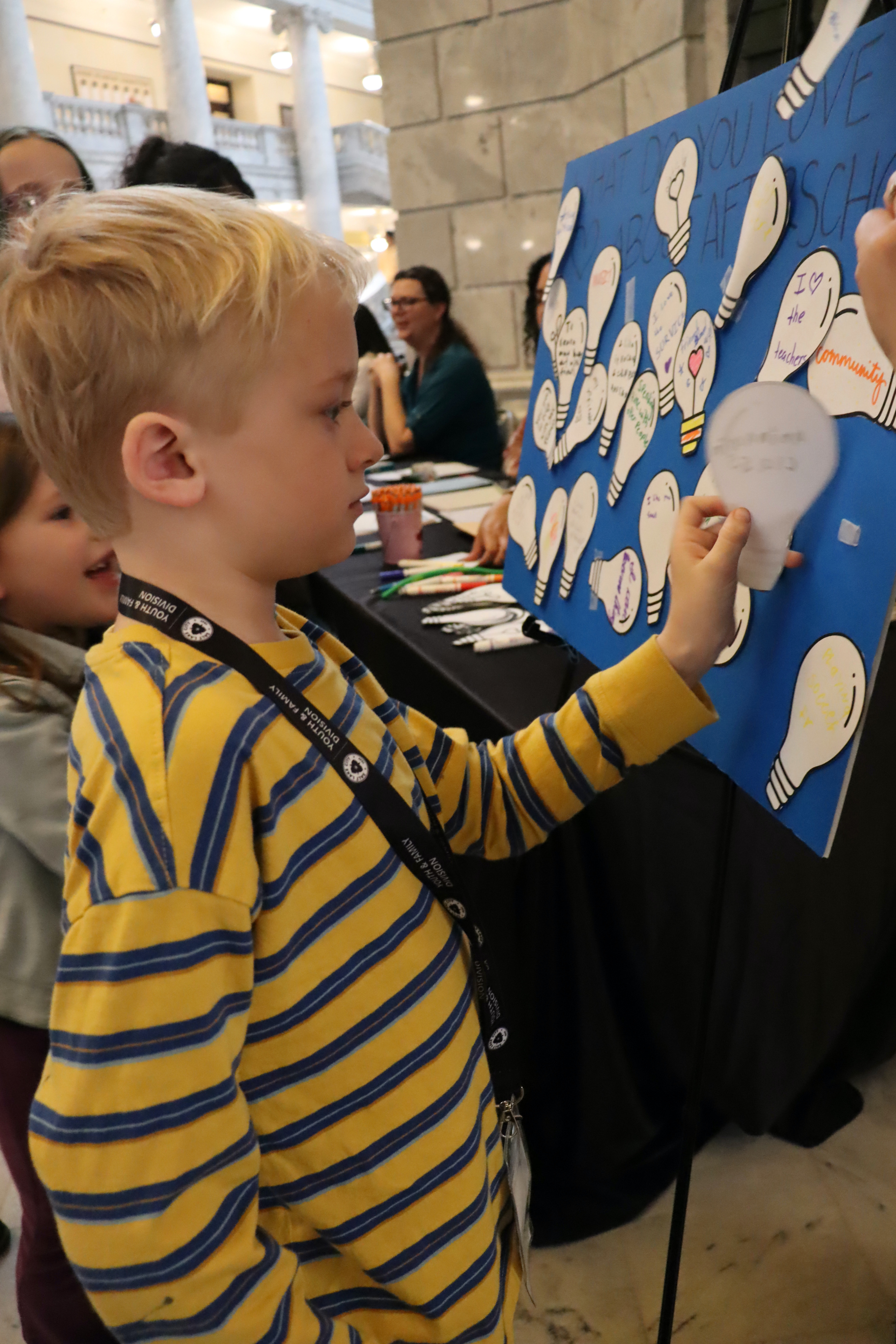 A child participates in an interactive activity during Afterschool Day on the Hill in Salt Lake City on Feb. 12, 2025.