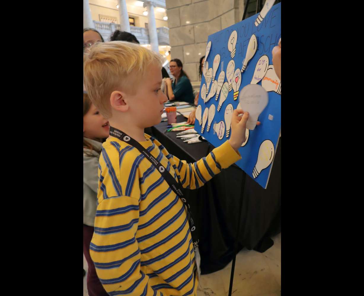 A child participates in an interactive activity during Afterschool Day on the Hill in Salt Lake City on Feb. 12, 2025.