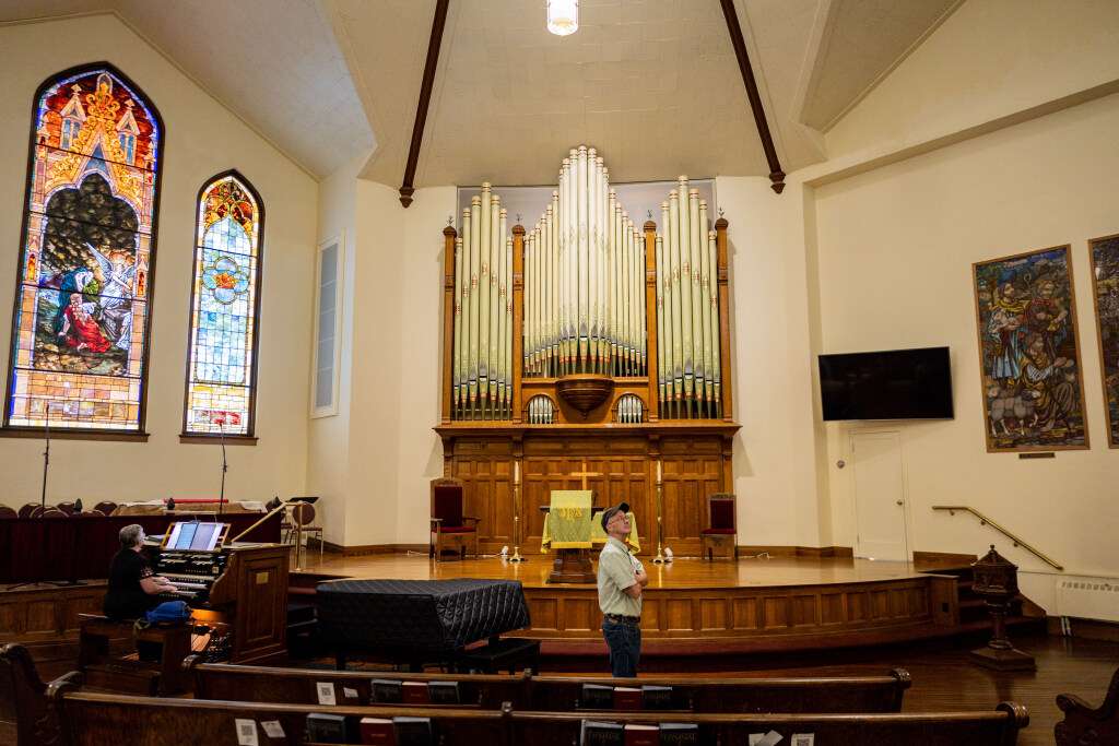 The interior of the First United Methodist Church features stained glass windows and a historic pipe organ on Tuesday.