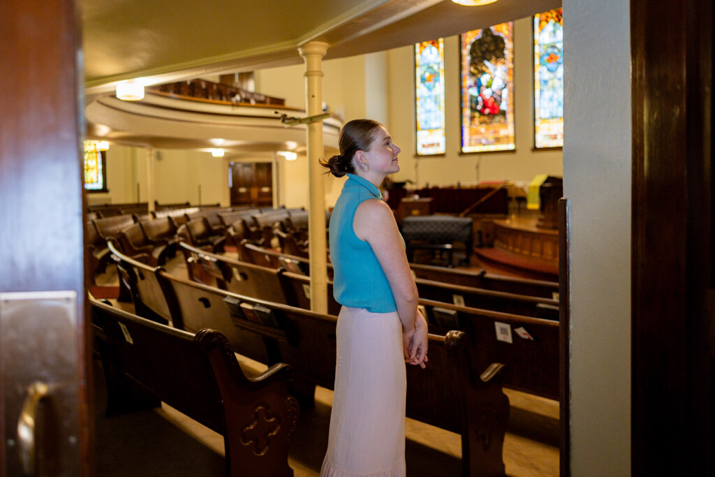 The Rev. Kelsie Parrish, pastor at First United Methodist Church, stands at the door to the sanctuary inside the First United Methodist Church in Salt Lake City on Tuesday.