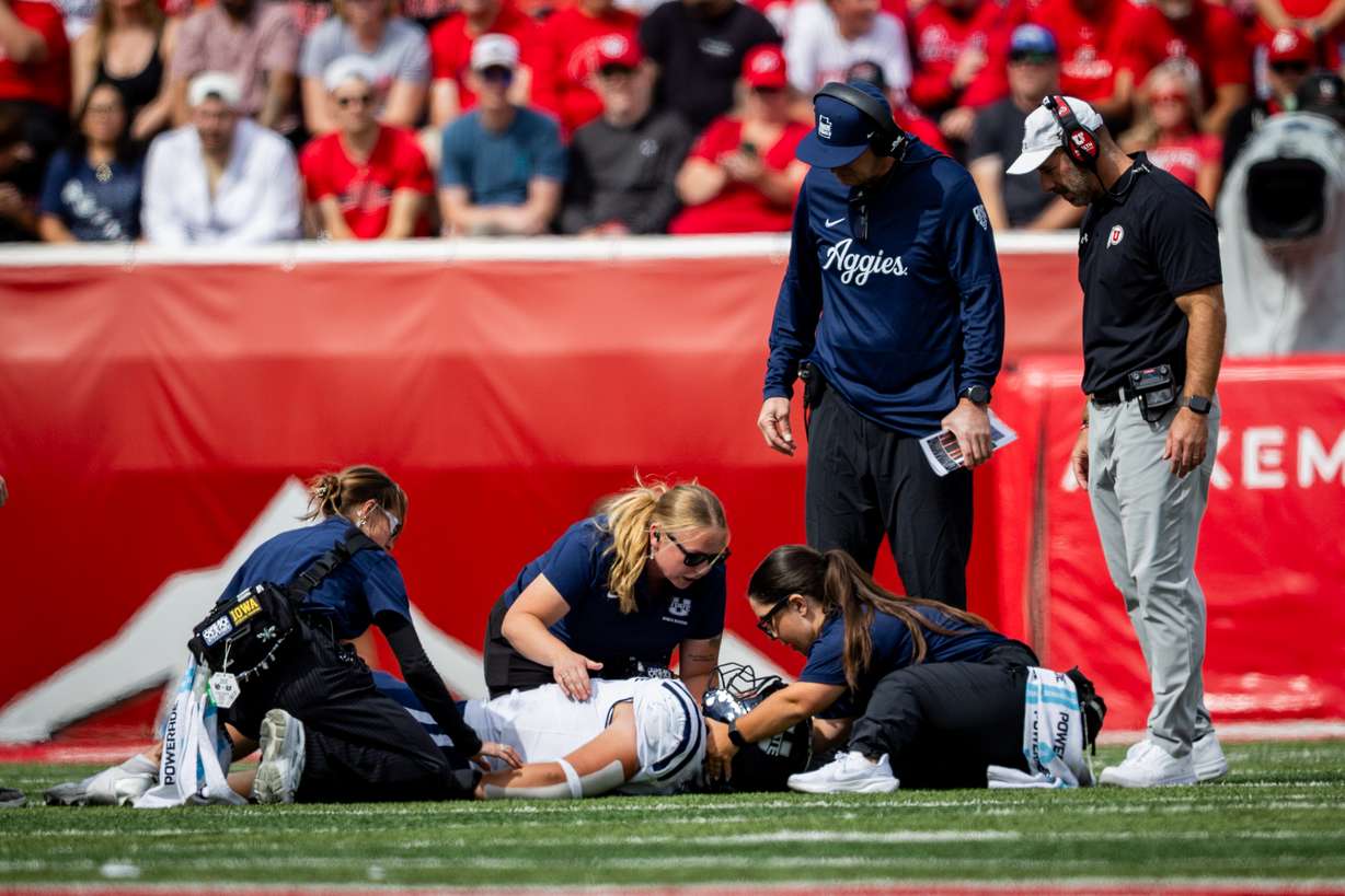 Utah State Aggies linebacker Harrison Taggart (0) is injured during a football game against the Utah Utes at Rice-Eccles Stadium in Salt Lake City on Saturday, Sept. 19, 2026.