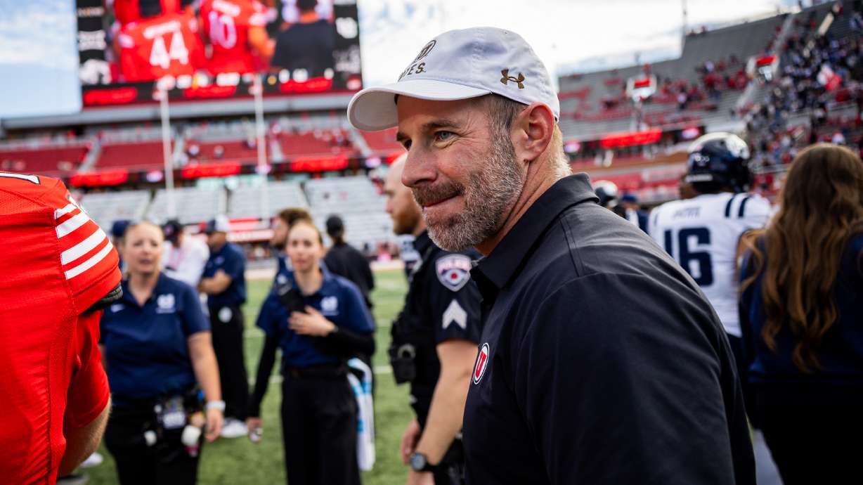 Utah Utes head coach Morgan Scalley walks on the field after the Utah Utes beat the Utah State Aggies in a football game at Rice-Eccles Stadium in Salt Lake City on Saturday, Sept. 19, 2026.