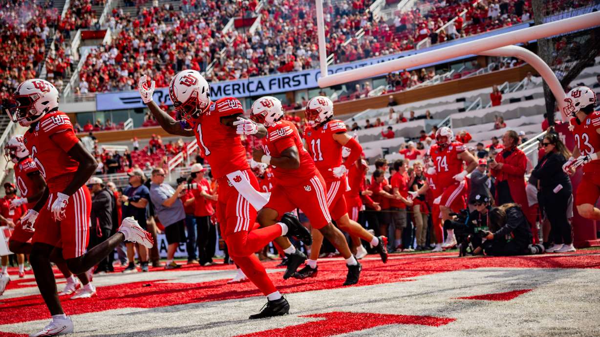 The Utah Utes run on the field before a football game against the Utah State Aggies at Rice-Eccles Stadium in Salt Lake City on Saturday, Sept. 19, 2026.