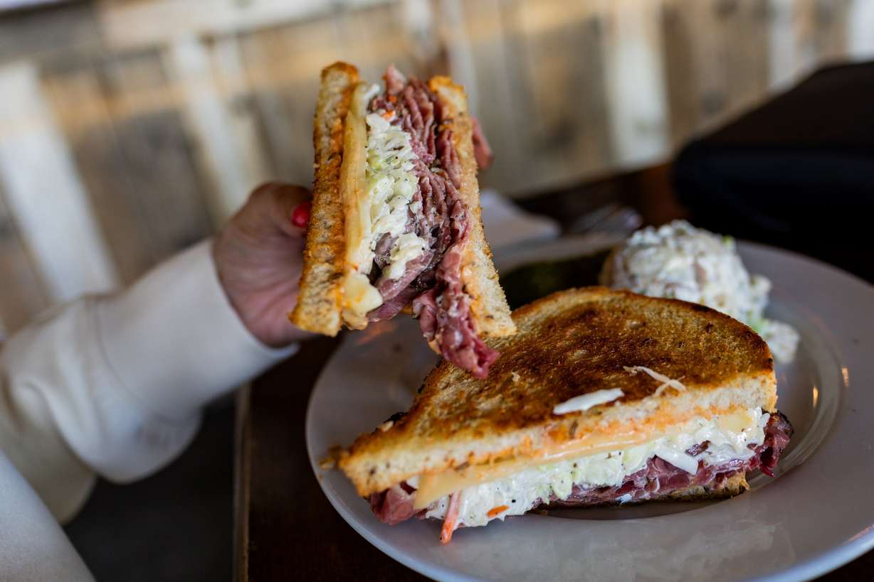 Jan Leaming, a regular, eats a Rachel sandwich at Feldman's Deli, which won a Bib Gourmand award in the inaugural 2026 Michelin Guide Southwest release, in Salt Lake City on Thursday.