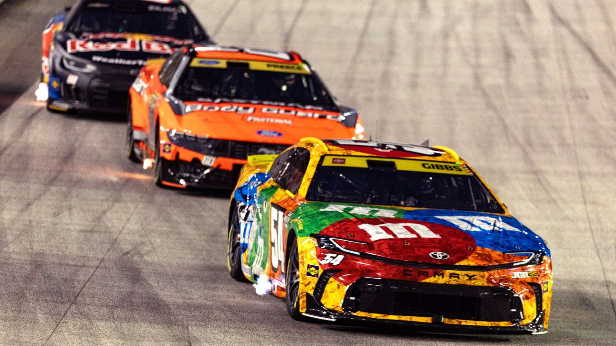 Ty Gibbs (54), in the throwback M&M's car honoring the late Kyle Busch, leads Ryan Preece and Connor Zilisch during a NASCAR Cup Series auto race Saturday, Sept. 19, 2026, in Bristol, Tenn.