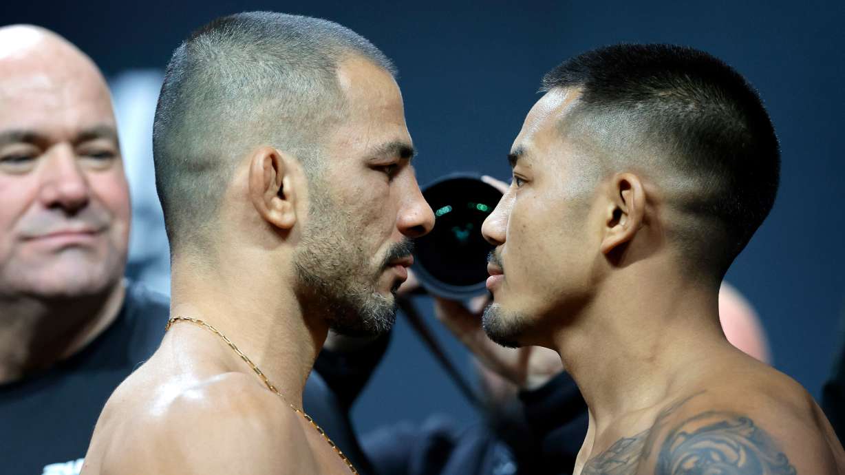 FILE - UFC flyweight champion Alexandre Pantoja, left, of Brazil, and Joshua Van, originally of Myanmar, face off during a ceremonial weigh-in for UFC 323 Friday, Dec. 5, 2025, in Las Vegas