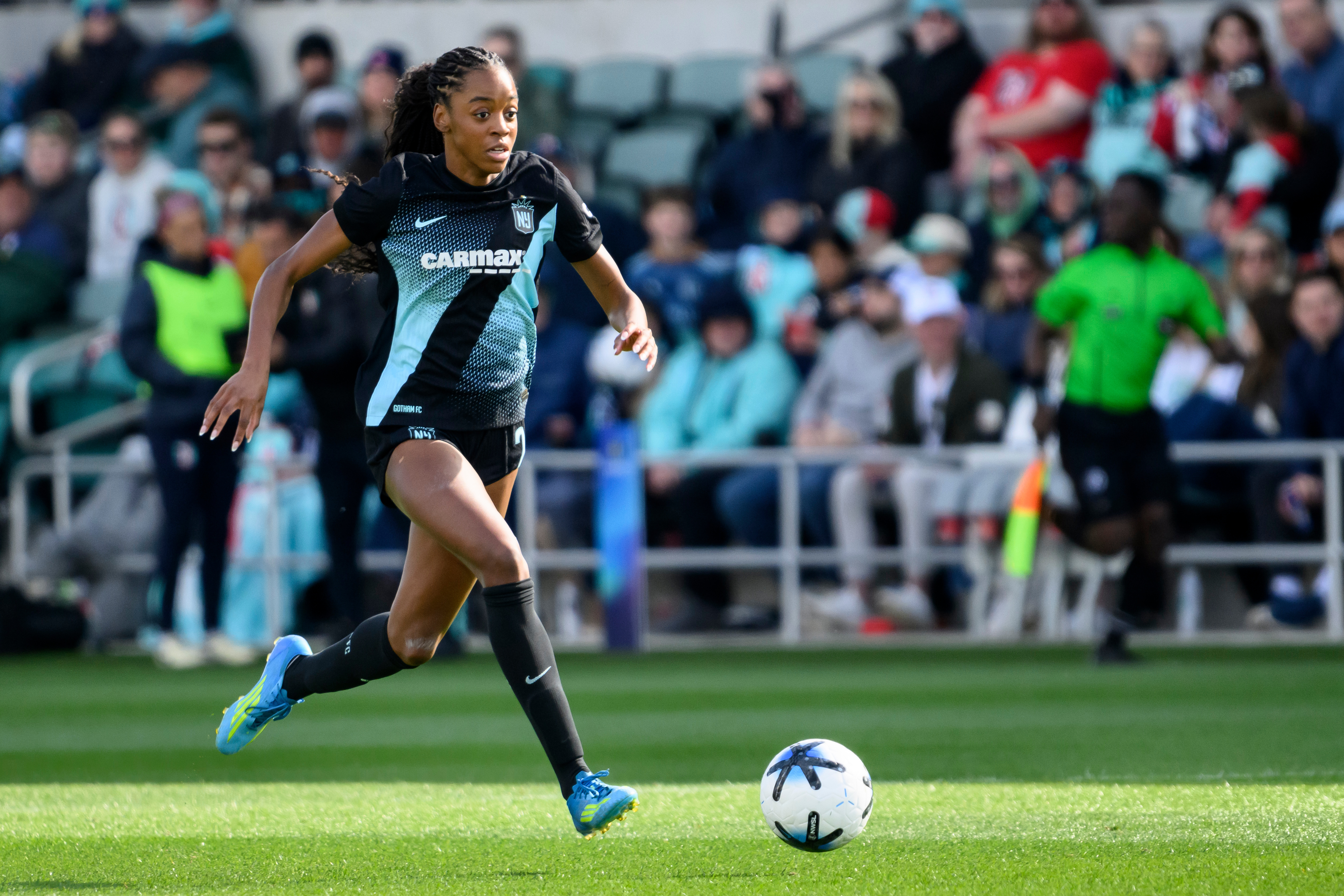 FILE- Gotham FC forward Jordynn Dudley brings the ball upfield against the Kansas City Current during an NWSL soccer match, April 4, 2026, in Kansas City, Mo. 