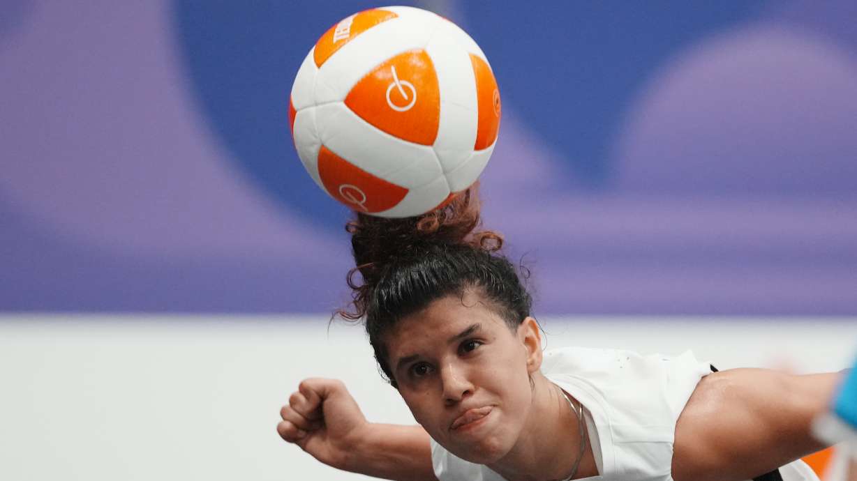 Lebanon's Kamar Dandal controls the ball during the women's singles bronze-medal teqball match against Cambodia's Koemyean Dy at the Asian Games in Nagoya, Japan, Sunday, Sept. 20, 2026.