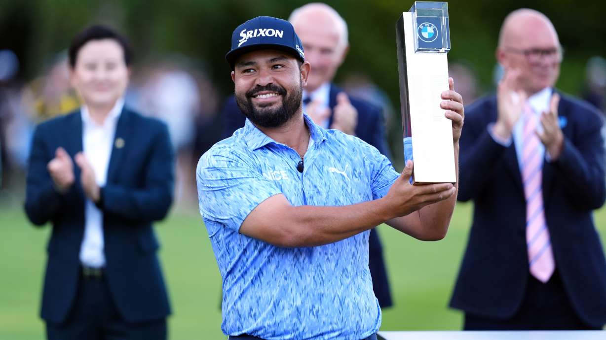 J. J. Spaun of United States lifts the trophy after winning the PGA Championship at Wentworth Golf Club in Virginia Water, England, Sunday Sept. 20, 2026.