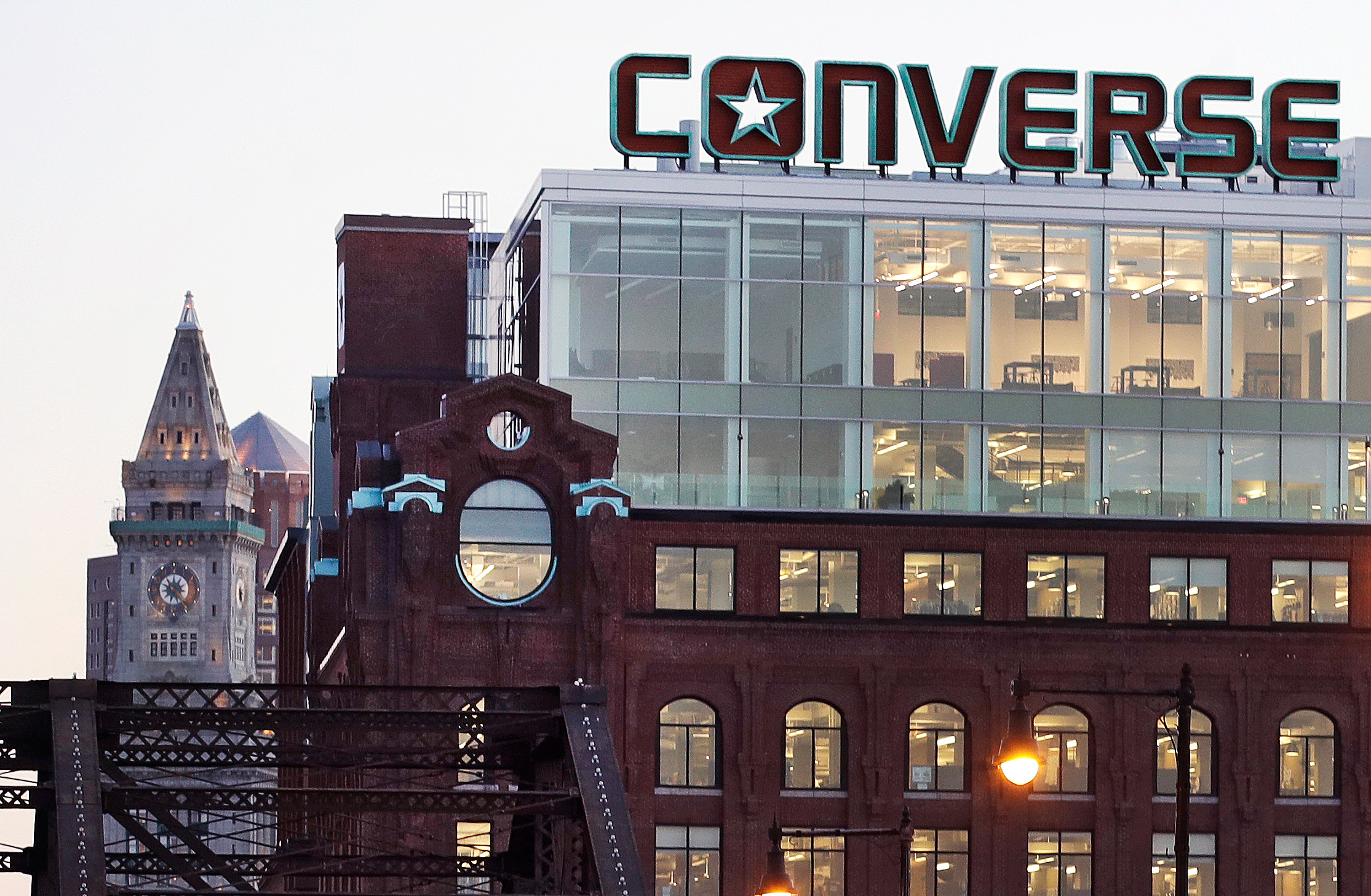 FILE - The Converse logo is displayed on the roof of the company's world headquarters in the West End neighborhood of Boston, Wednesday, Dec. 28, 2016. 