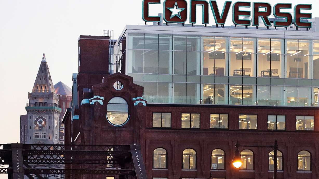 FILE - The Converse logo is displayed on the roof of the company's world headquarters in the West End neighborhood of Boston, Wednesday, Dec. 28, 2016.