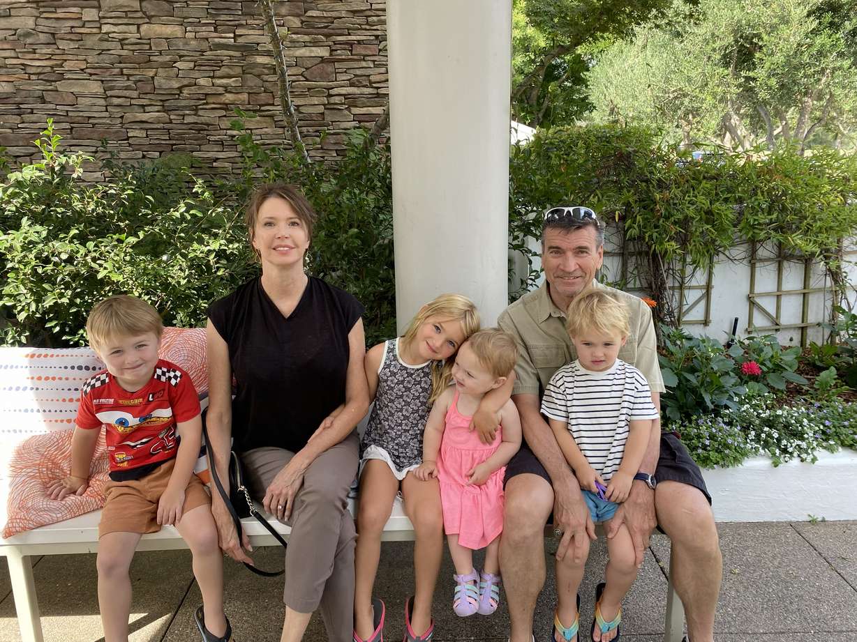 KSL NewsRadio host Greg Skordas and his wife with some of their grandchildren. He said his relationship with his kids has changed over the years, especially as they began having their own children.