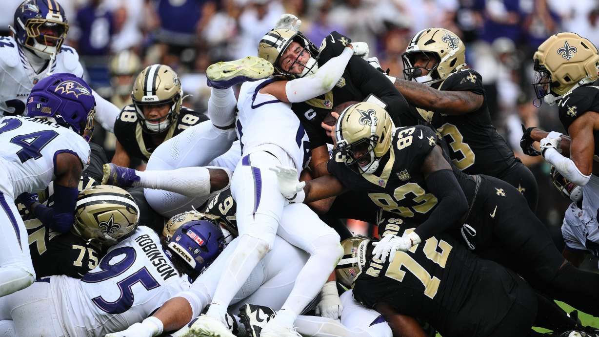 iNew Orleans Saints quarterback Tyler Shough converts on a fourth and one for a first down n the second half of an NFL football game in Baltimore, Sunday, Sept. 20, 2026.