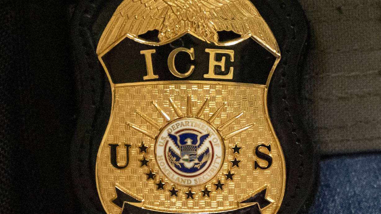 A federal agent wears an Immigration and Customs Enforcement badge in New York, June 10, 2025.