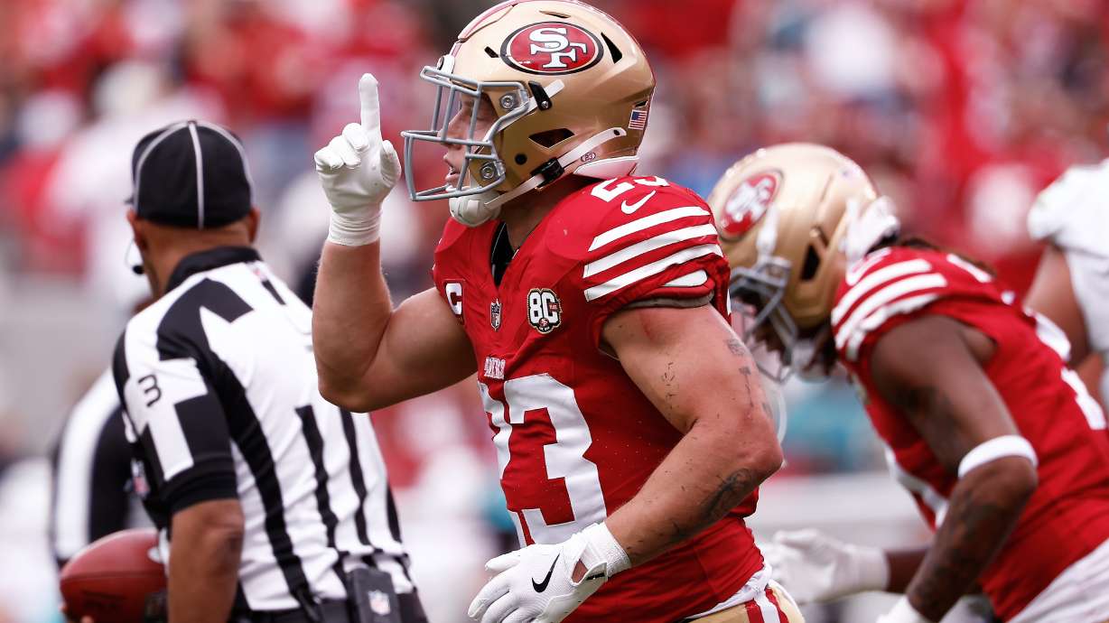 San Francisco 49ers running back Christian McCaffrey celebrates after scoring against the Miami Dolphins during the first half of an NFL football game in Santa Clara, Calif., Sunday, Sept. 20, 2026.