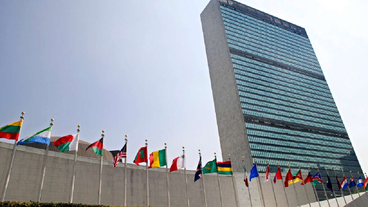 In this Sept. 13, 2005 file photo, the flags of member nations fly outside the General Assembly building at the United Nations headquarters in New York. France will summon Iran's ambassador and take appropriate measures in response after Iranian authorities sealed a French language center affiliated with its embassy in Tehran.