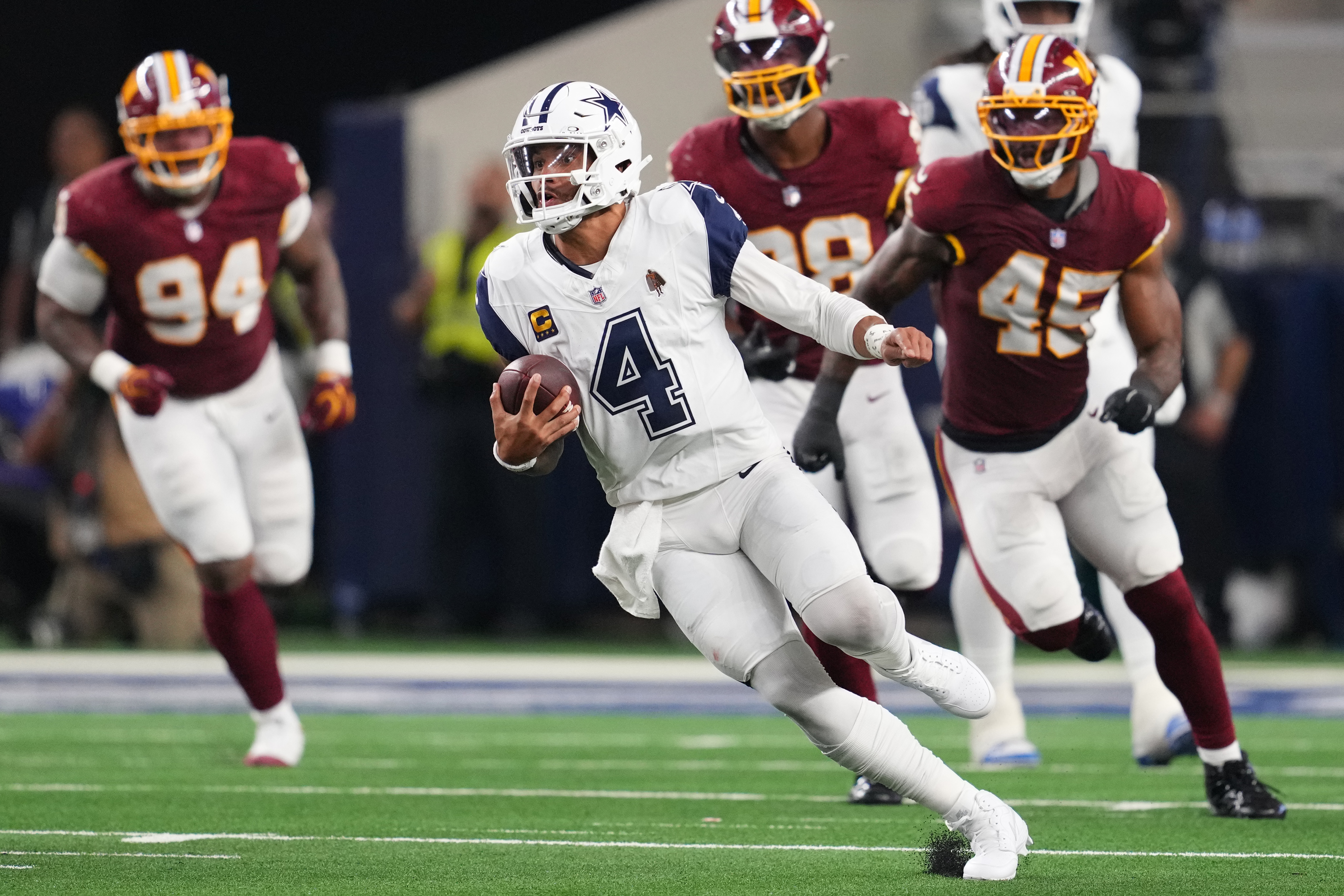 Dak Prescott throws 4 TD passes as Cowboys beat Commanders, who lose Jayden Daniels to elbow injury