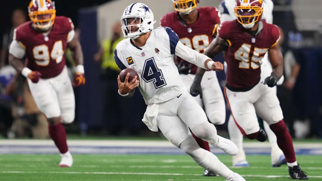 Dallas Cowboys quarterback Dak Prescott (4) runs against the Washington Commanders in the second half during an NFL football game in Arlington, Texas, Sunday, Sept. 20, 2026.