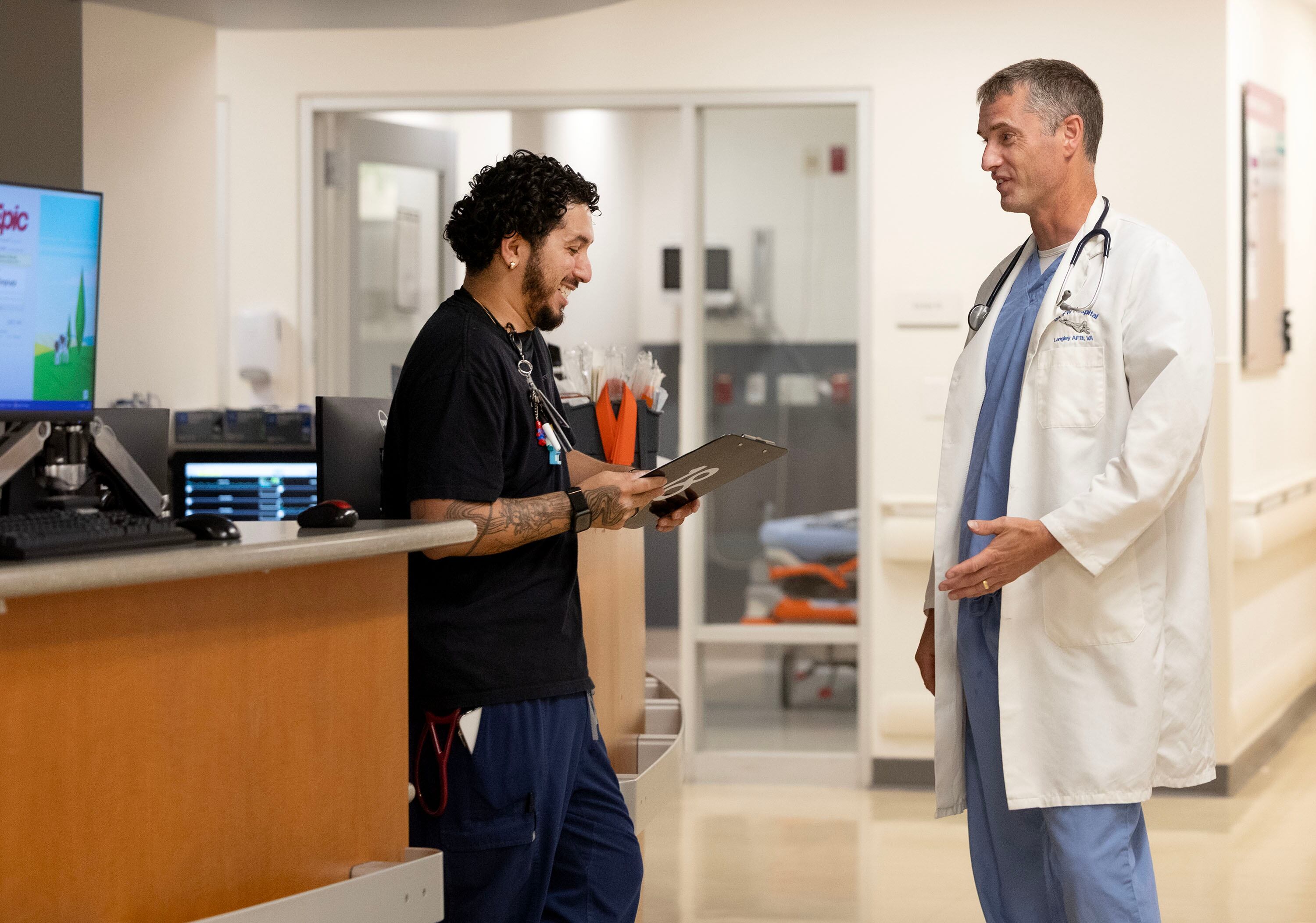 Manu Renteria, RN, speaks with Dr. James Dahle, emergency medicine physician, at Holy Cross Hospital-Jordan Valley in West Jordan on Aug. 26. Dahle has a blog and website called "The White Coat Investor" that helps doctors manage their money.