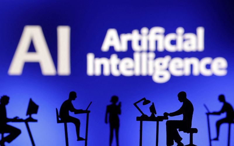 Figurines with computers and smartphones are seen in front of the words "Artificial Intelligence AI" in this illustration taken, February 19, 2024.