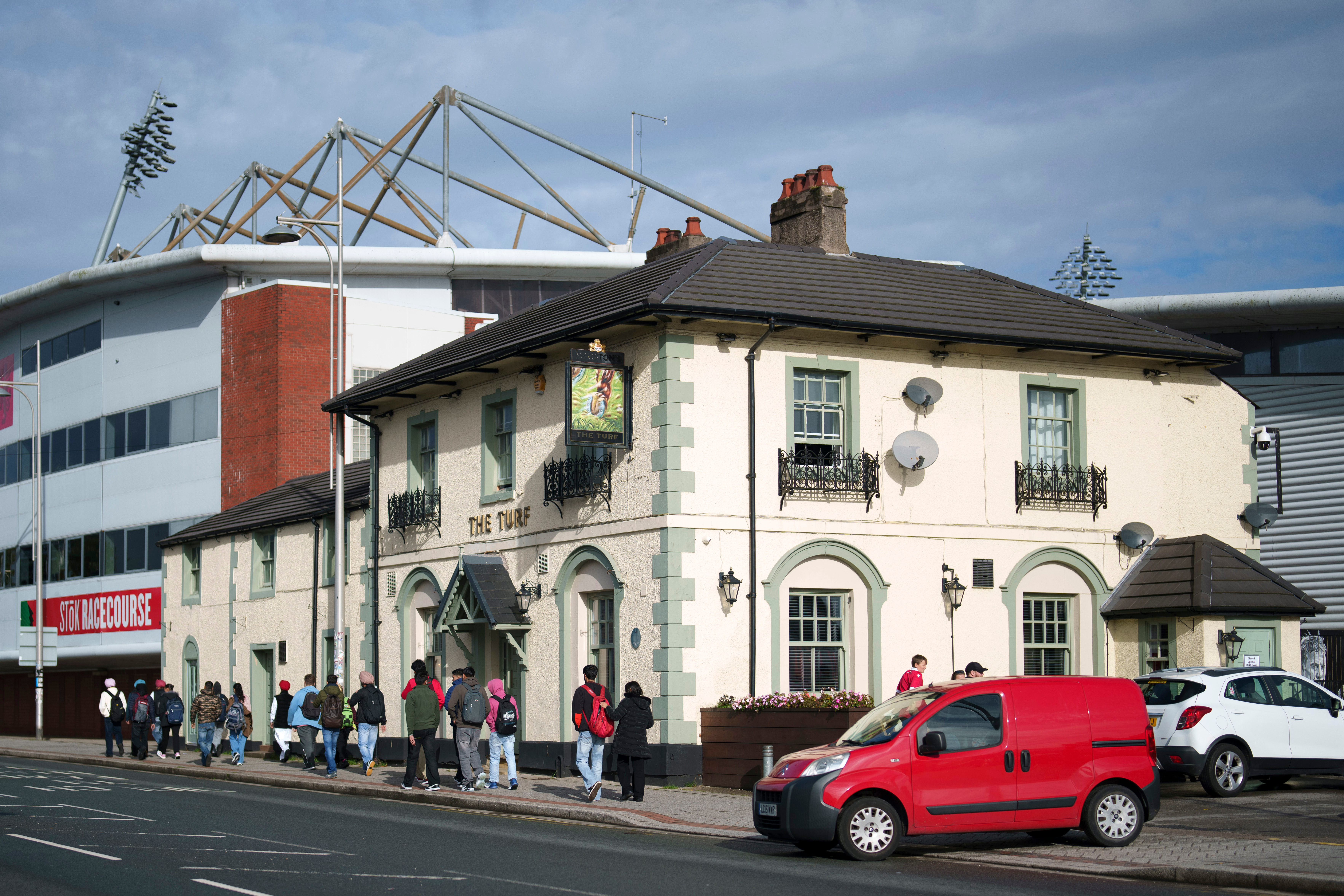 Cheers! Wrexham's celebrity owners buy 'The Turf' pub that's adjacent to the club's stadium