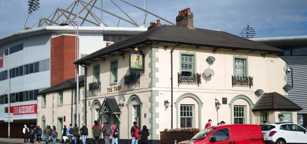 Cheers! Wrexham's celebrity owners buy 'The Turf' pub that's adjacent to the club's stadium