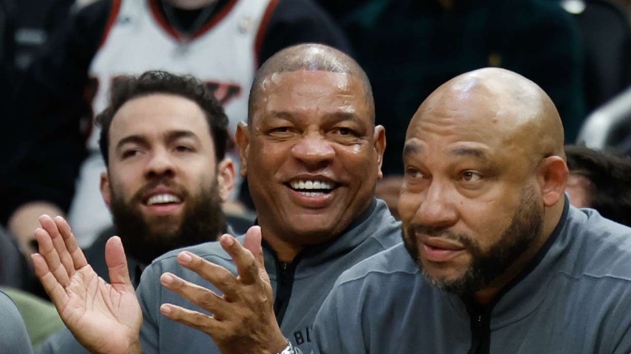 FILE - Milwaukee Bucks head coach Doc Rivers, center, applauds during the first half of an NBA basketball game against the Dallas Mavericks, March 31, 2026, in Milwaukee.