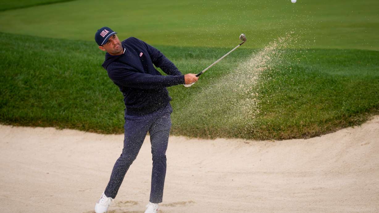 USA teams' Scottie Scheffler practices on the fifth hole prior to the start of the Presidents Cup golf tournament against the International team at Medinah Country Club, Monday, Sept. 21, 2026, in Medinah, Ill.