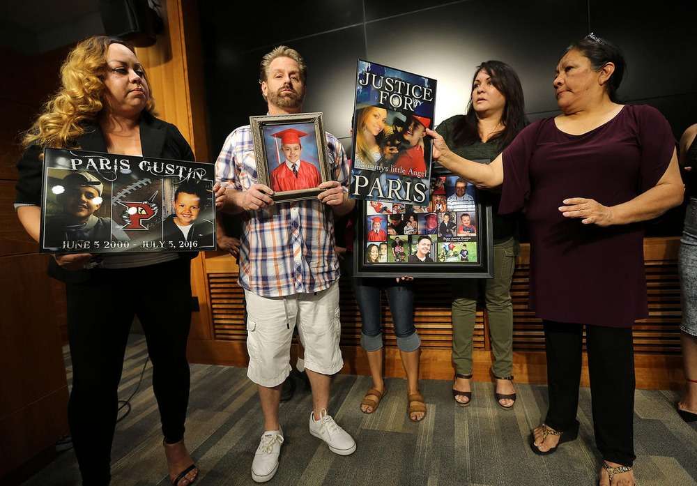 Ashley Gustin (left) and other family members at a press conference about the killing of her 16-year-old son, Paris Gustin, on Thursday, Aug. 18, 2016. The mother spoke at a sentencing for one of the men involved on Monday.