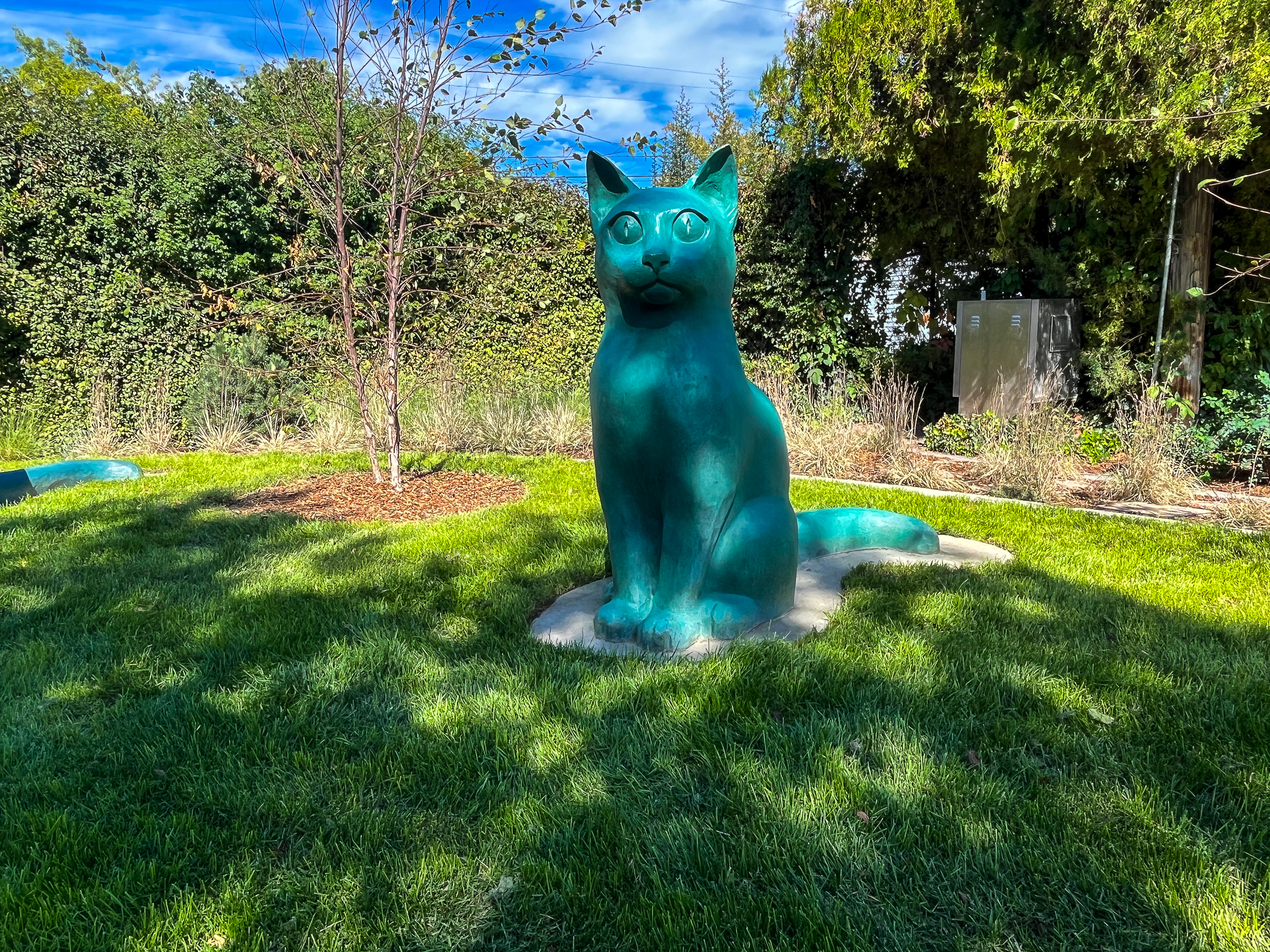 One of the cat statues at Joseph F. Steenblik Park is pictured on Monday.