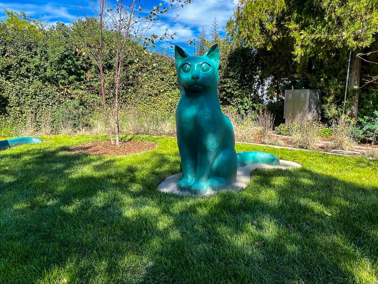 One of the cat statues at Joseph F. Steenblik Park is pictured on Monday.